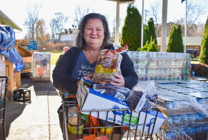 Helen, a neighbor, receives food from the Foodbank's network