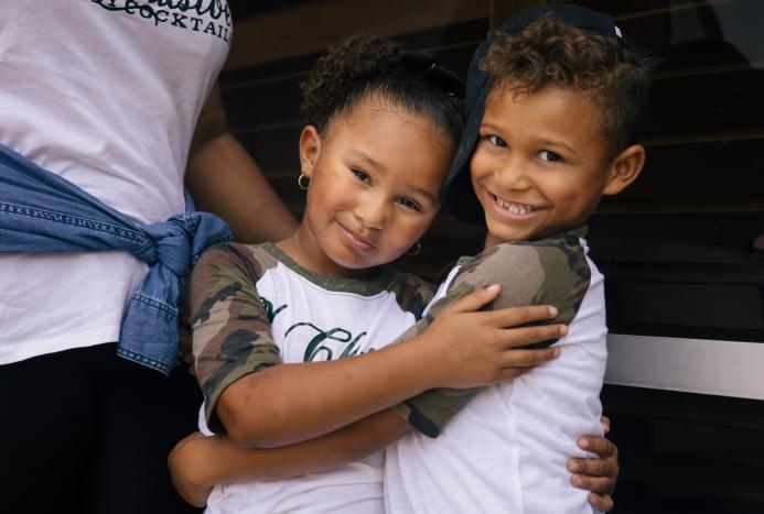 two kids hugging