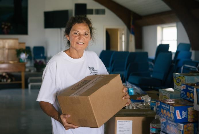 woman holding a box of food