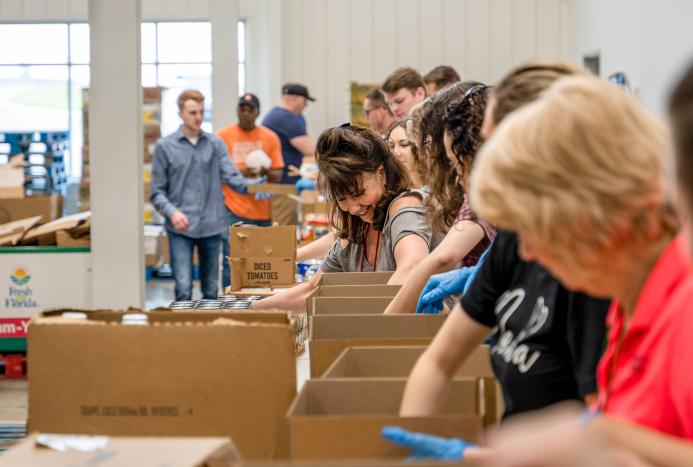 Volunteers packing boxes
