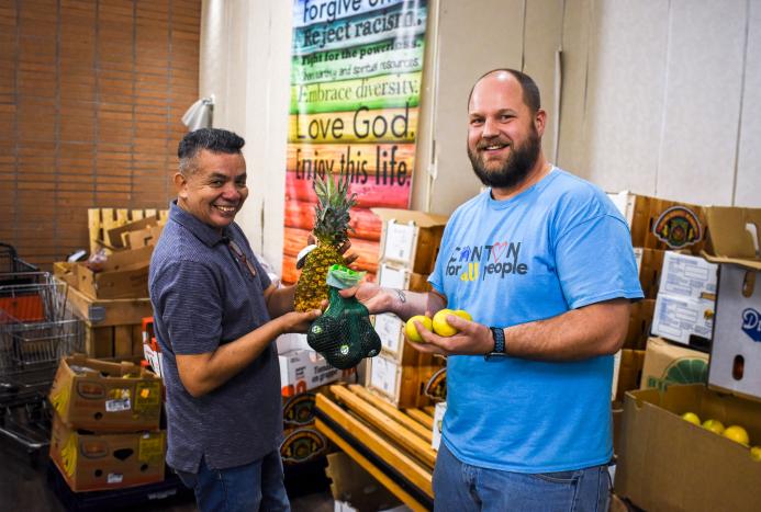 Pastor Mitch and volunteer in food pantry