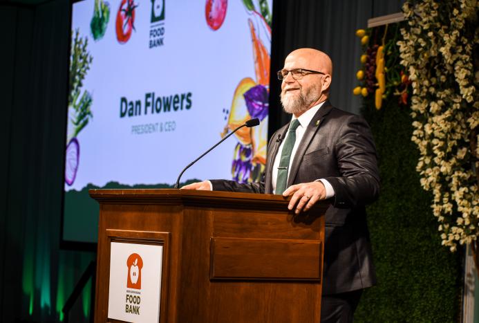 Dan Flowers speaking at the luncheon
