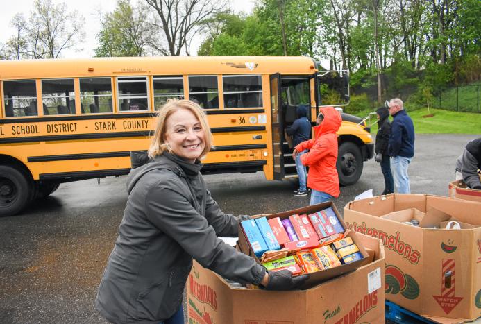woman unloading school bus