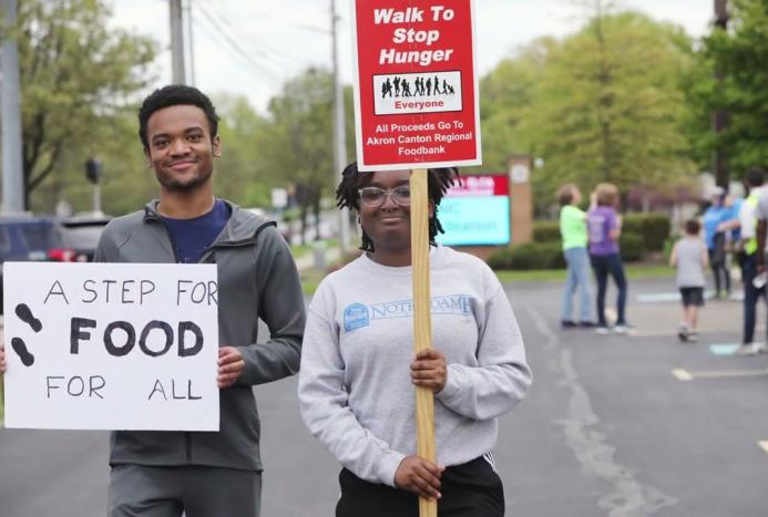 Two individuals participate in the Hunger Walk