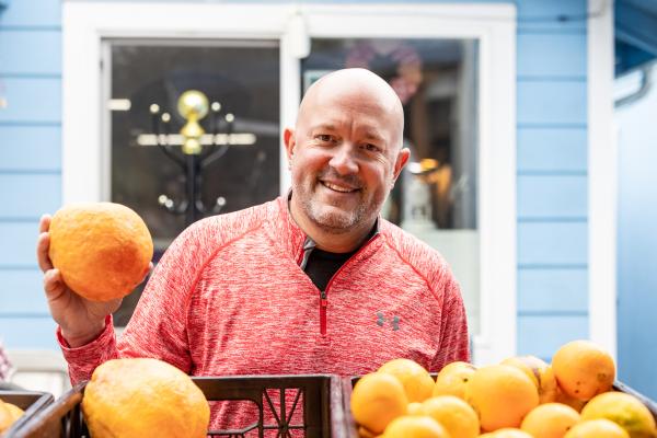 man holding fresh produce