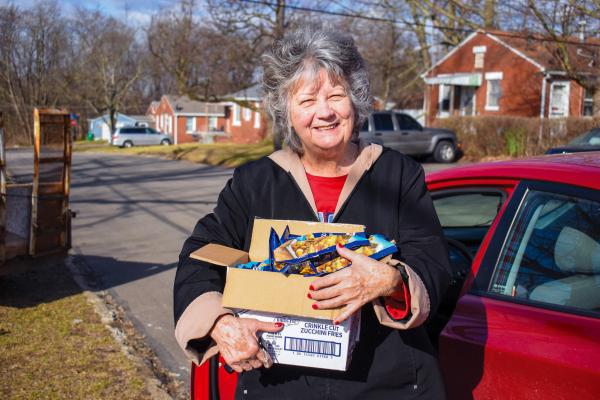 woman holding food