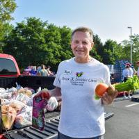 man holding produce