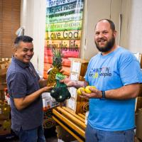 Pastor Mitch and volunteer in food pantry