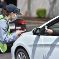 person by car