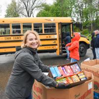 woman unloading school bus